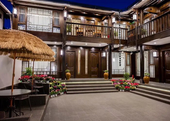 Golden Dragon'S Mountain Glow Inn Chinese Style Courtyard Of Lijiang Ancient Town Close To Main Streets Near By Dashiqiao Sifang Street,Big Water Wheels,We Offer Tickets Purchasing Services,Free Station Pick-Up For Three Nights Of,Provide Nutritious