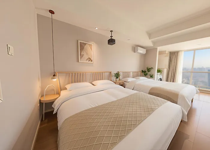 Huayue Apartment Hotel - Shanghai & Metro Line 18 Zhoupu Station华悦酒店上海浦东万达广场店